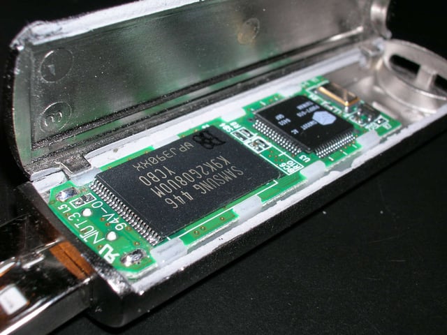 The microcontroller on the right of this USB flash drive is controlled with embedded firmware.