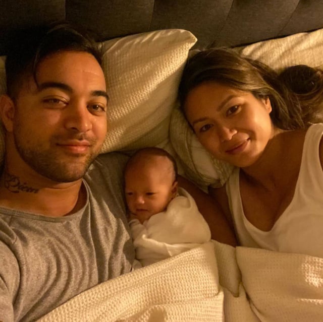 Chris and Natasha with their first child