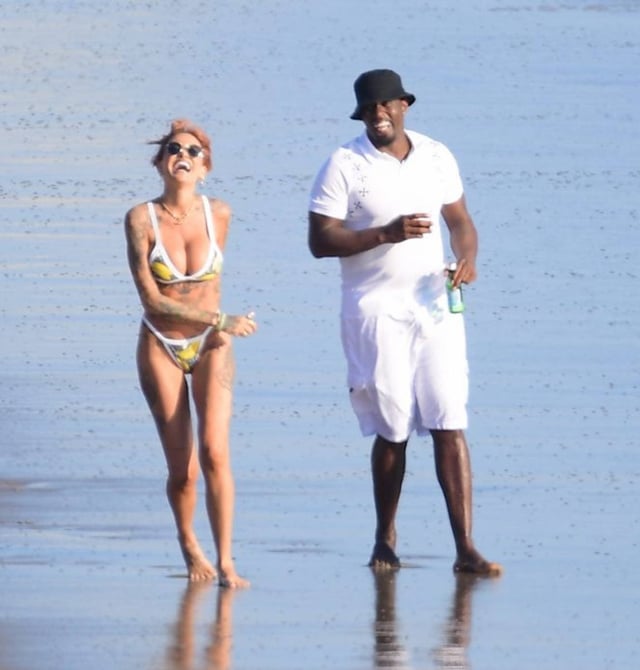 Tina Louise and Diddy have a laugh on the beach