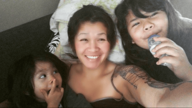 With her two daughters.