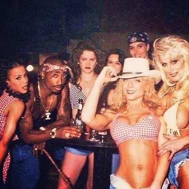 2Pac with some of the female cast in the "How Do U Want It" music video; several women who were well-known porn stars in the 90's.