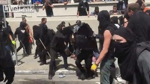 From the right, Eric can be seen attacking someone with a bike lock.