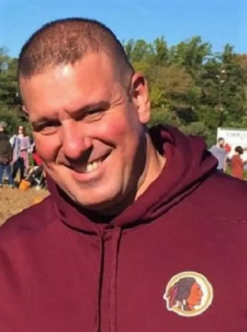 Mark Zeitounian wearing a Washington Redskins sweatshirt