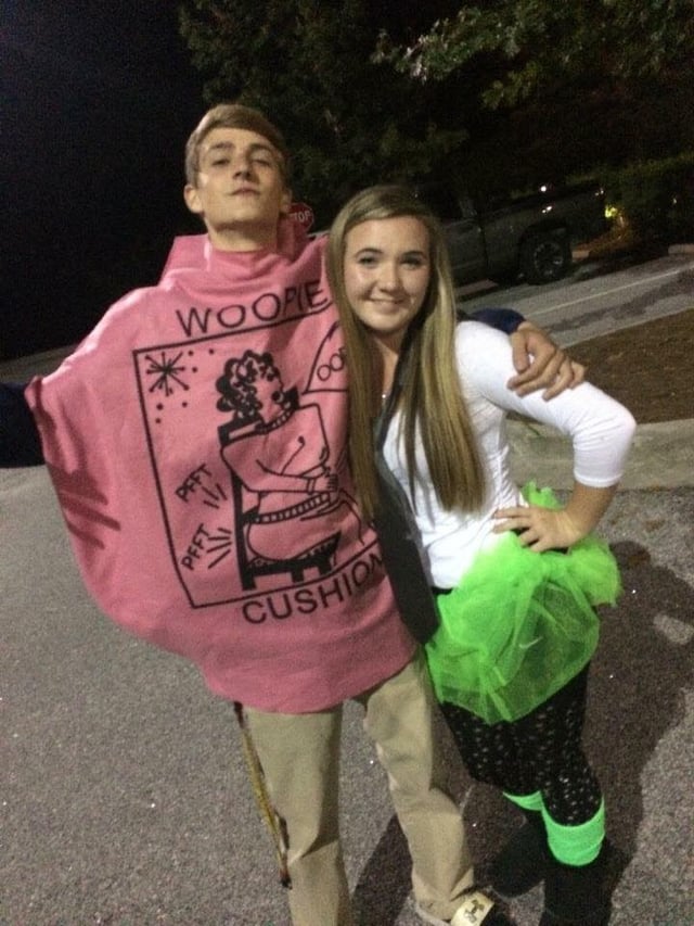 Sam with his arm around a female friend