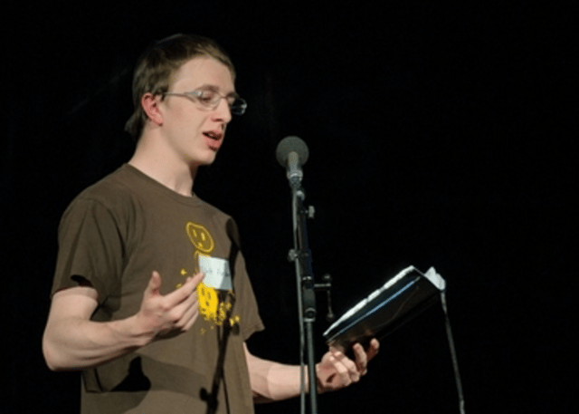 Photo of Micah when he performed at a poetry contest in High School.