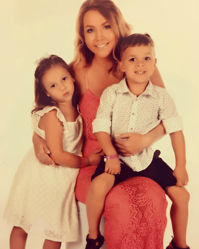 Photo of Rubia with her two children.