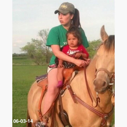 Riding a horse with a baby