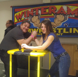 Photo of Jennifer Bush with her father at an arm wrestling competition in Penatanguishine, Ontario which she won
