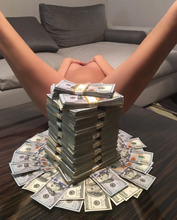 Photo of Tony Toutouni's stack of money covering a woman's body parts.
