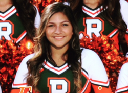 Photo of Angela Gomez in her cheerleading outfit.