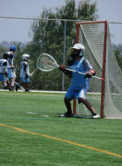 Photo of Matthew Cobos playing goalie for the Lacross team that he was a part of as a young man.