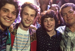 Photo of Tyler Grasham with some of the talent he represented along with Finn Wolfhard.