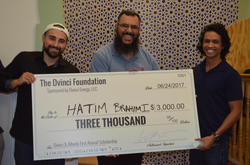 Holding a check from the Dvinci Foundation with Walid Halty