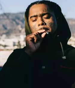 Photo of 03 Greedo smoking a joint.