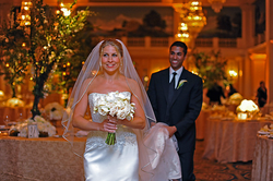 Wedding photo of Janine Van Lancker and Ajit Pai walking up the wedding aisle