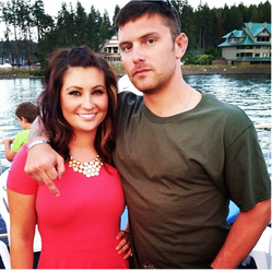Photo of Willow Palin with her brother Track Palin, who subtly gives the middle finger to the camera by having upside down.