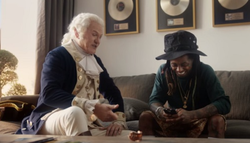 Actor playing the part of George Washington along with Lil Wayne from a Super Bowl ad that was apparently shown in 2016.