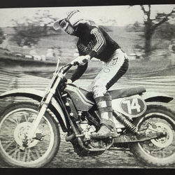 Photo of Christopher Heisser riding his motor cross when he was young man.