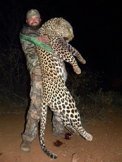 Photo of Mark Martineau after a leopard hunt.