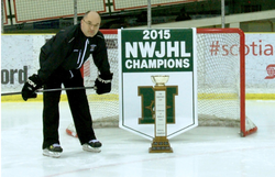 Photo of Darcy Haugan with a championship trophy.