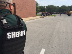 Photo of a Sheriff's Deputy at the scene of the shooting