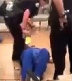 Screenshot taken from the moments that police officers take down Roger Davis.