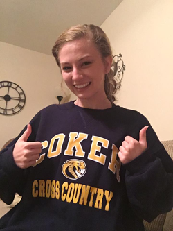 Lauren Emily Pearson wearing a Coker Cobras Cross Country sweatshirt