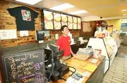 Photo taken of a happy worker at Doos Seafood and Deli.