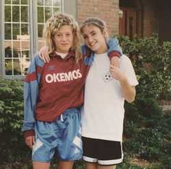 Cynthia Frelund (right) and a friend in their Okemos High School soccer uniforms