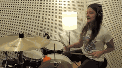 GIF of Pearl Andersson playing a drum cover of Only Girl (song) by Rihanna.