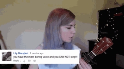 GIF of Elise Ecklund playing a song she wrote with lyrics that have only hate comments.