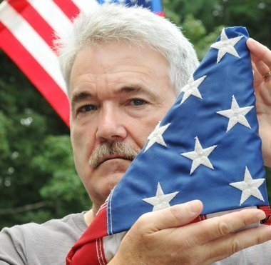 Larry Kelley with the American Flag