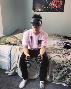 Zachary Schwartz wearing Virtual reality goggles.