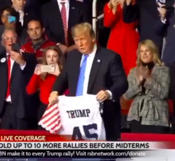 Donald Trump holding Trump Jersey from Jersey Champs