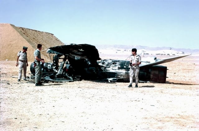 Israeli troops examine destroyed Egyptian aircraft.