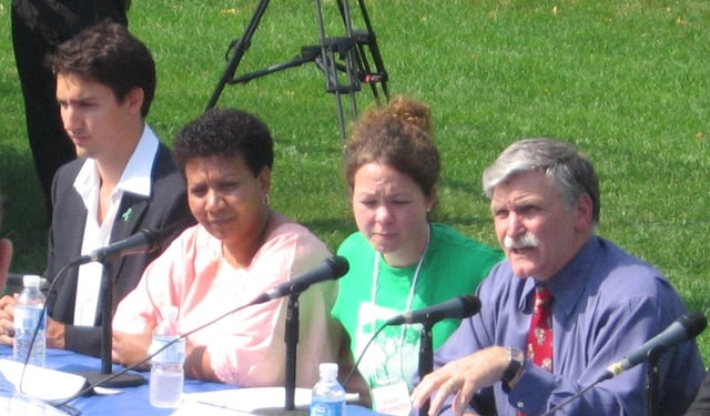 Left to right at a Darfur rally, 2006: Trudeau, Darfurian refugee Tragi Mustafa, one of the event organisers, and Senator Roméo Dallaire
