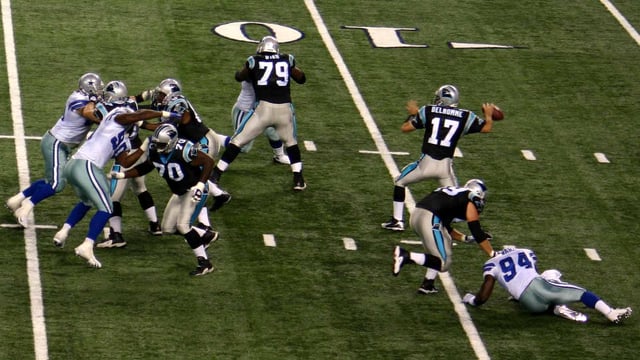 Carolina Panthers quarterback Jake Delhomme (number 17) in the motion of throwing a forward pass