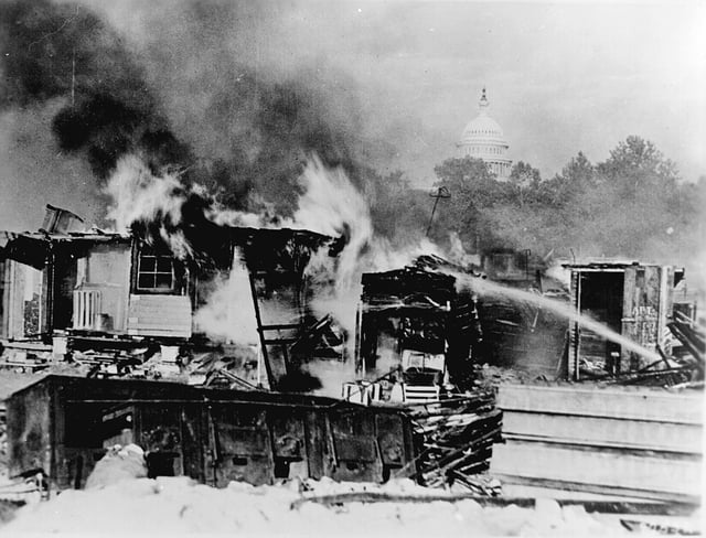 Shacks on the Anacostia flats, Washington, D.C. put up by the Bonus Army (World War I veterans) burning after the battle with the 1,000 soldiers accompanied by tanks and machine guns, 1932