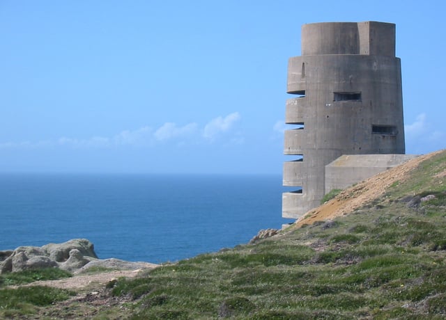 As part of the Atlantic Wall, between 1940 and 1945 the occupying German forces and the Organisation Todt constructed fortifications round the coasts of the Channel Islands, such as this observation tower at Les Landes, Jersey.
