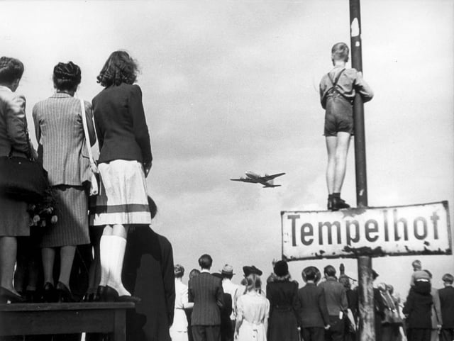 Germans watching Western supply planes at Berlin Tempelhof Airport during the Berlin Airlift