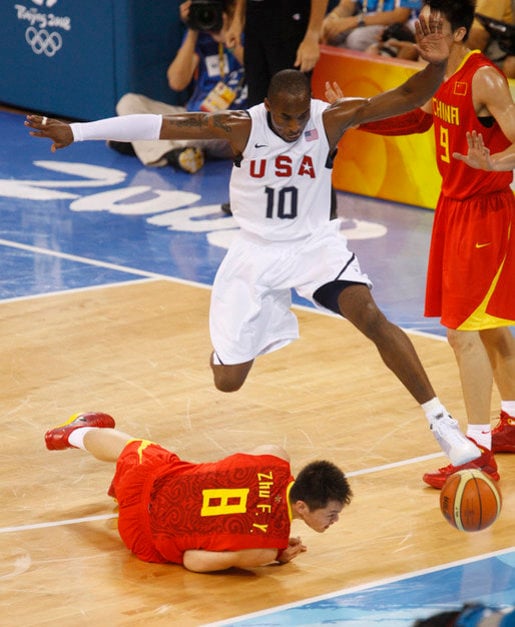 Bryant avoiding a collision in a game against China at the 2008 Summer Olympics