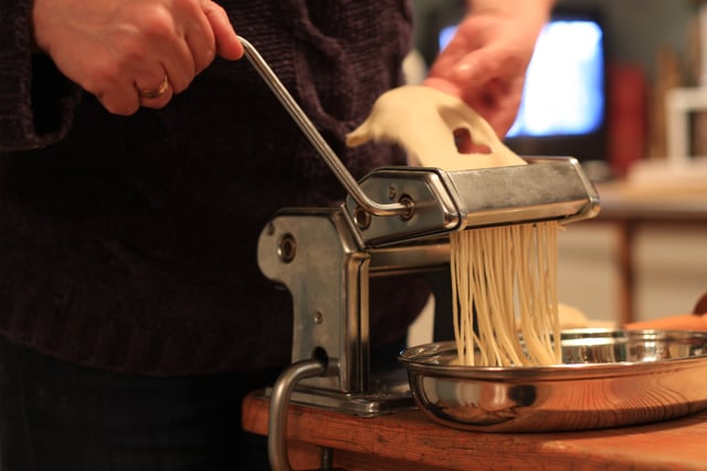 A pasta machine in use