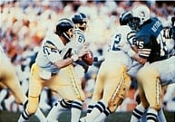 Chargers' quarterback back Dan Fouts (middle) runs a play against the Dolphins in the AFC Divisional Playoff game.