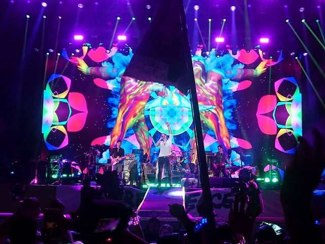 Coldplay performing "Adventure of a Lifetime", during their headline setlist at Glastonbury 2016. The performance was their fifth at the festival, and a record-setting fourth as headliners.