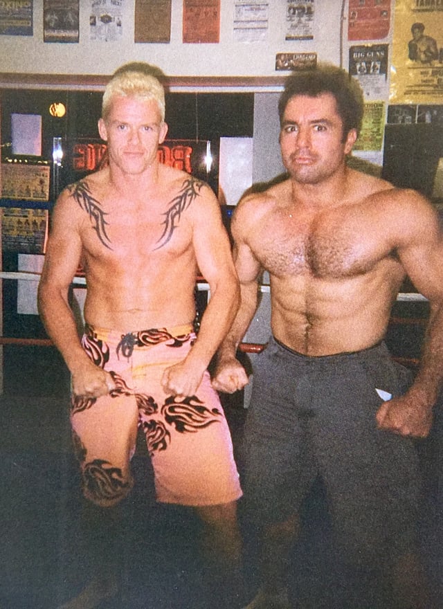 Rogan posing in a boxing ring, 2002
