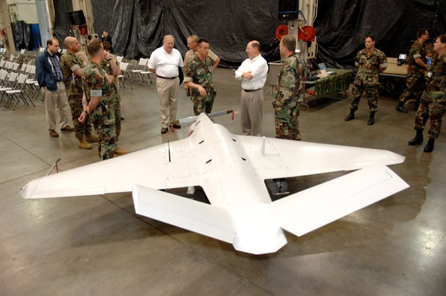 Secretary of the Navy, Donald C. Winter is briefed on the Sentry HP UAV at Dam Neck, 2007