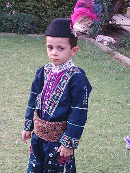 Assyrian child dressed in traditional clothes