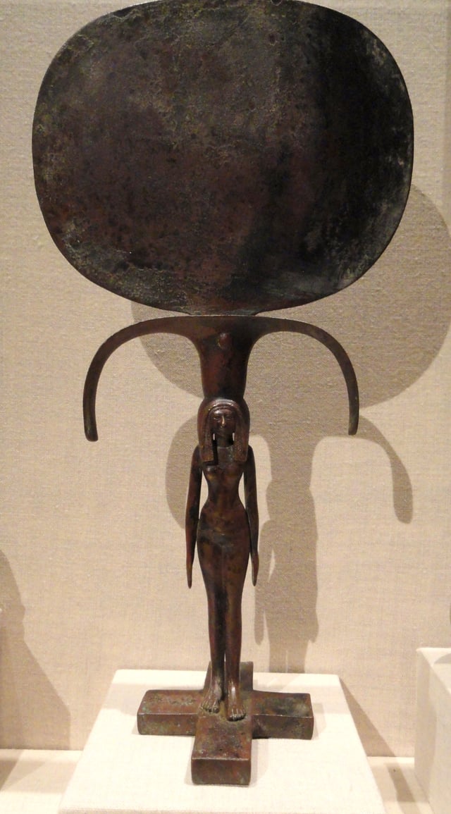 Bronze mirror with a female human figure at the base, Eighteenth dynasty of Egypt (1540–1296 BC)