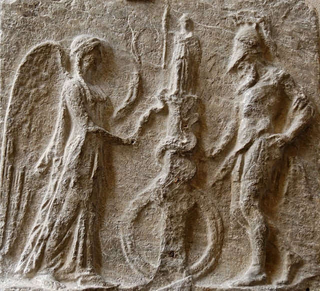 Relief (1st century AD) depicting the Palladium atop a column entwined by a snake, to which Victory presents an egg as a warrior attends in a pose of peace