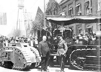 Benjamin Holt (left) with British Col. Ernest Dunlop Swinton in Stockton, April 1918. The vehicle on the right is a Holt tractor; on the left is a miniature replica of a British tank.